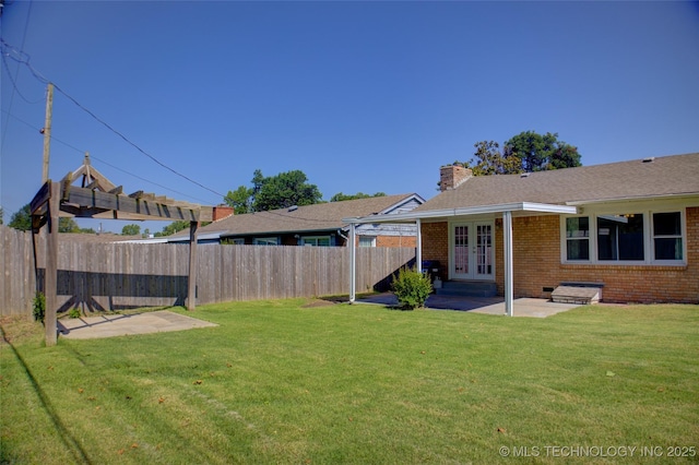 4424 E 59th Pl S, Tulsa, OK 74135 - fenced backyard with french doors and a patio