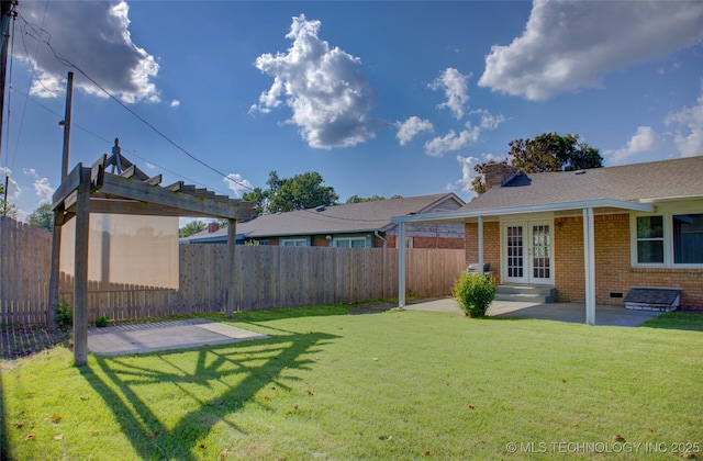 4424 E 59th Pl S, Tulsa, OK 74135 - fenced backyard featuring french doors and a patio