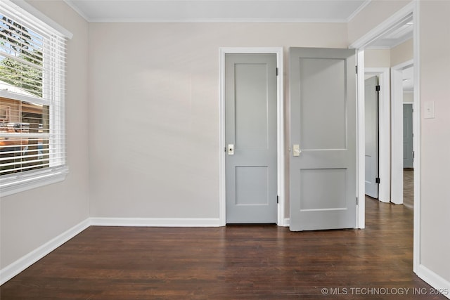 227 S Toledo Ave, Tulsa, OK 74112 - unfurnished bedroom with wood finished floors and ornamental molding