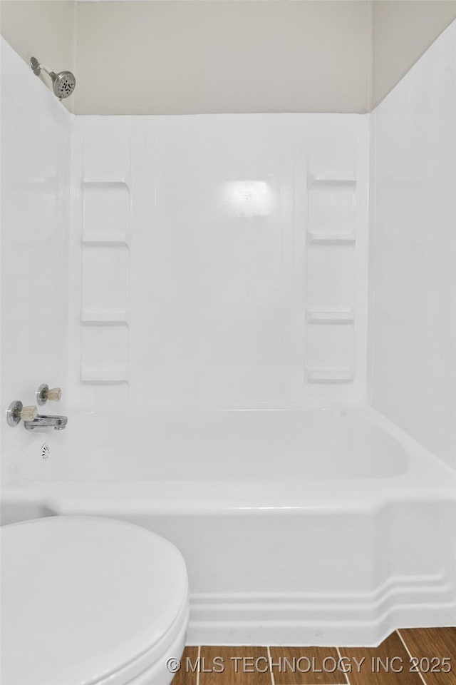 227 S Toledo Ave, Tulsa, OK 74112 - bathroom featuring shower / bath combination and wood finished floors