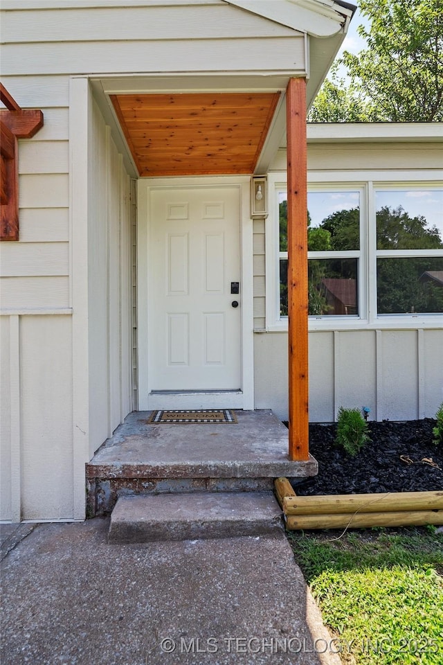 227 S Toledo Ave, Tulsa, OK 74112 - view of exterior entry featuring board and batten siding