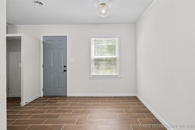 227 S Toledo Ave, Tulsa, OK 74112 - foyer featuring wood finish floors and ornamental molding