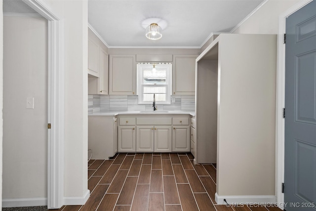 227 S Toledo Ave, Tulsa, OK 74112 - kitchen with dark wood-type flooring, decorative backsplash, light countertops, ornamental molding, and white cabinets