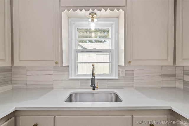 227 S Toledo Ave, Tulsa, OK 74112 - kitchen with light countertops and tasteful backsplash
