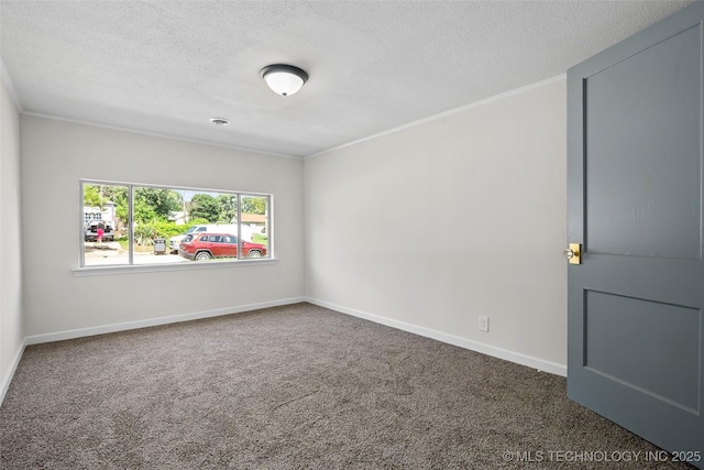 227 S Toledo Ave, Tulsa, OK 74112 - carpeted spare room featuring a textured ceiling and ornamental molding