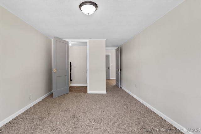 227 S Toledo Ave, Tulsa, OK 74112 - unfurnished bedroom featuring carpet flooring and ornamental molding