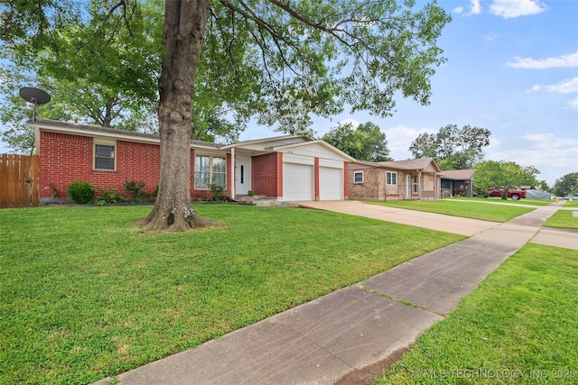 12750 E 23rd St, Tulsa, OK 74129 - ranch-style home with brick siding, driveway, and an attached garage