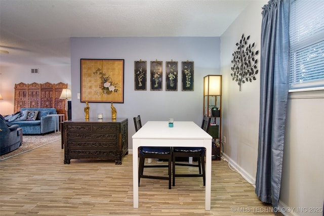 12750 E 23rd St, Tulsa, OK 74129 - dining area with light wood finished floors and baseboards
