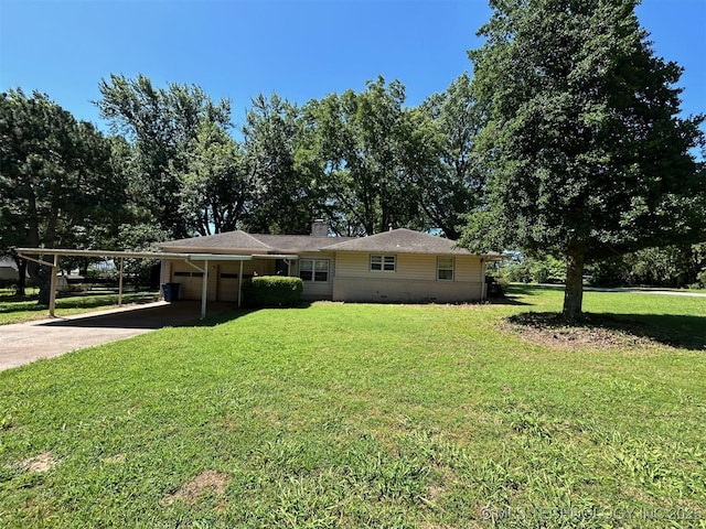 4905 S Columbia Ave, Tulsa, OK 74105 - view of front facade featuring a garage, concrete driveway, a front lawn, an attached carport, and a chimney