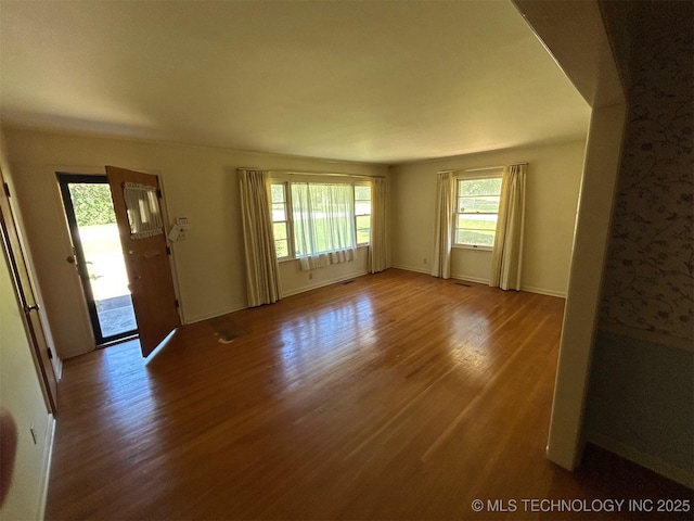 4905 S Columbia Ave, Tulsa, OK 74105 - unfurnished living room with wood finished floors