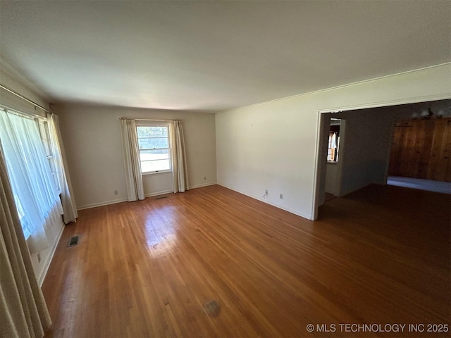 4905 S Columbia Ave, Tulsa, OK 74105 - unfurnished room with wood finished floors and baseboards
