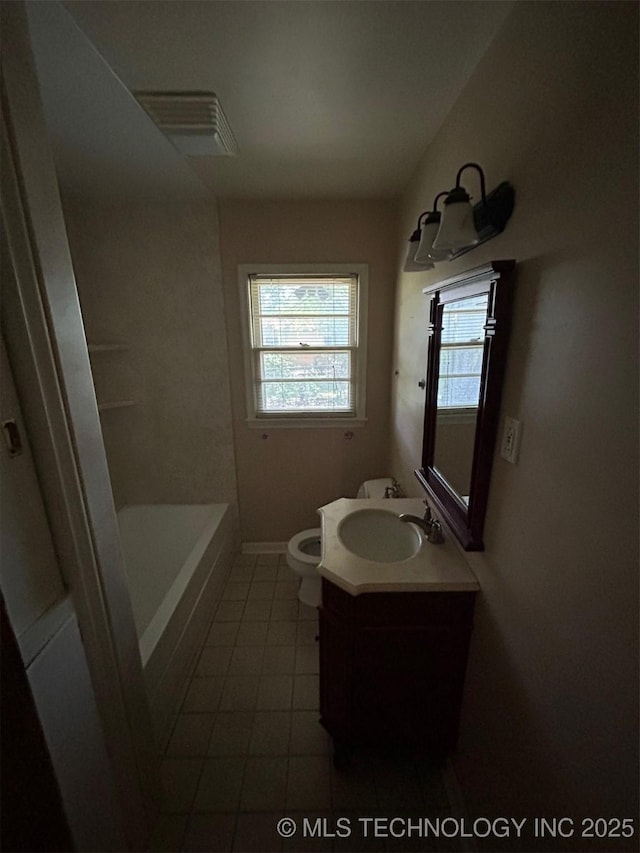 4905 S Columbia Ave, Tulsa, OK 74105 - full bathroom with tile patterned floors, vanity, and a tub
