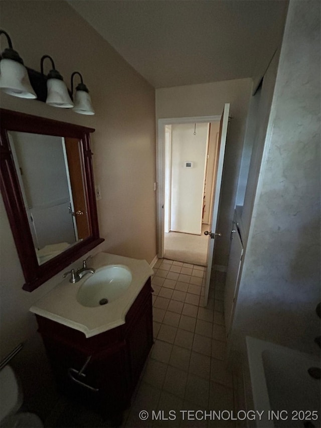 4905 S Columbia Ave, Tulsa, OK 74105 - full bathroom featuring vanity, tile patterned floors, and a bath