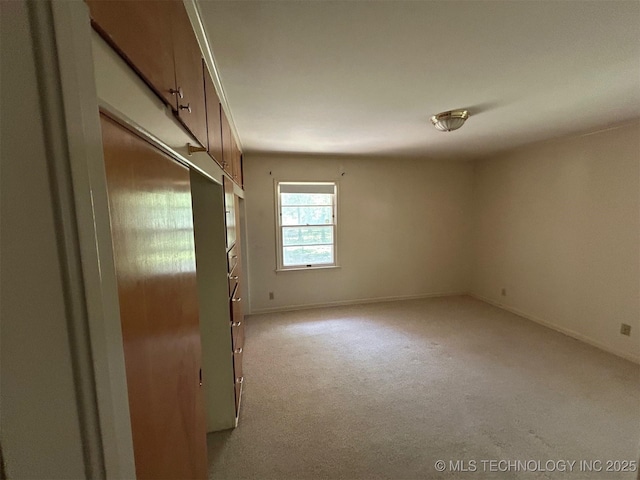 4905 S Columbia Ave, Tulsa, OK 74105 - spare room featuring carpet and baseboards