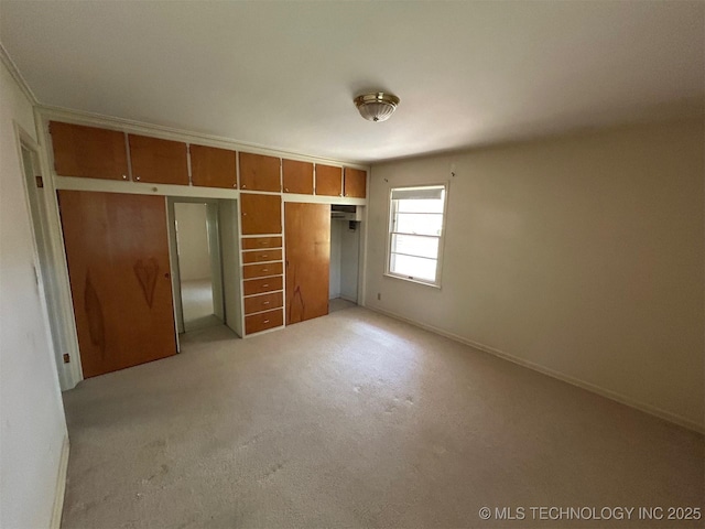 4905 S Columbia Ave, Tulsa, OK 74105 - unfurnished bedroom featuring light colored carpet and a closet
