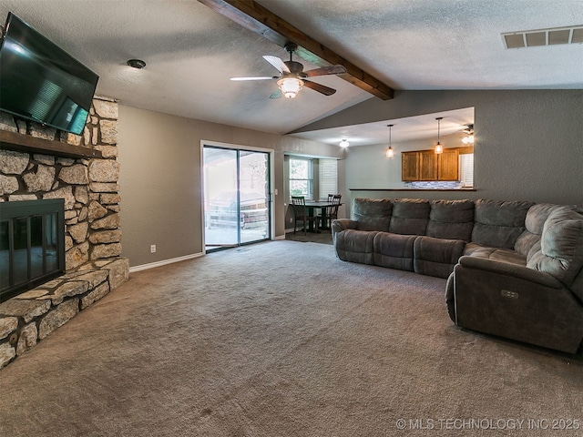25136 Hickory Ln, Broken Arrow, OK 74014 - living area with carpet flooring, a ceiling fan, a textured ceiling, and a fireplace
