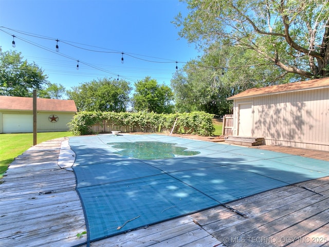 25136 Hickory Ln, Broken Arrow, OK 74014 - view of swimming pool with a wooden deck and an outdoor structure