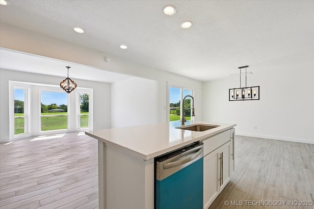 13973 S 237th E Ave, Coweta, OK 74429 - kitchen with dishwasher, a chandelier, light wood finished floors, plenty of natural light, and a textured ceiling