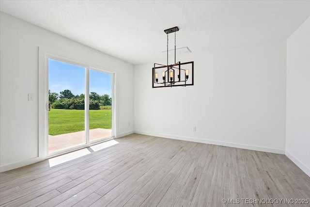 13973 S 237th E Ave, Coweta, OK 74429 - unfurnished dining area featuring a chandelier and light wood-style floors