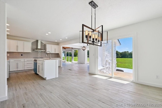 13973 S 237th E Ave, Coweta, OK 74429 - kitchen with wall chimney exhaust hood, plenty of natural light, open floor plan, light countertops, and recessed lighting