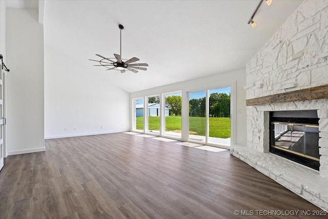 13973 S 237th E Ave, Coweta, OK 74429 - unfurnished living room with ceiling fan, a fireplace, dark wood finished floors, and high vaulted ceiling