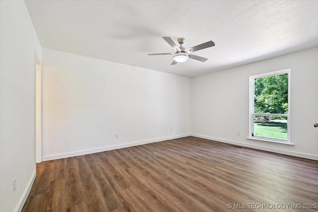 13973 S 237th E Ave, Coweta, OK 74429 - empty room with wood finished floors and a ceiling fan