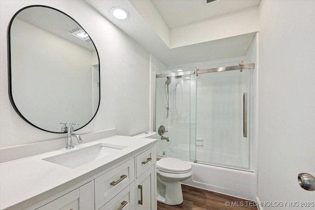13973 S 237th E Ave, Coweta, OK 74429 - full bathroom with vanity, wood finished floors, and combined bath / shower with glass door