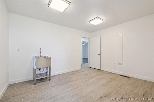 13973 S 237th E Ave, Coweta, OK 74429 - unfurnished room featuring light wood-style floors and baseboards