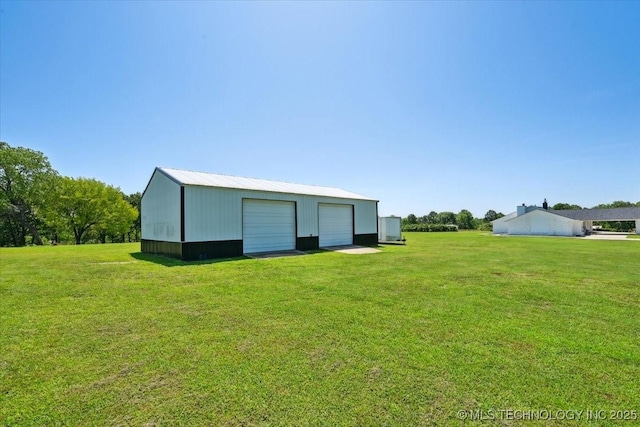13973 S 237th E Ave, Coweta, OK 74429 - view of grassy yard with a detached garage and an outbuilding