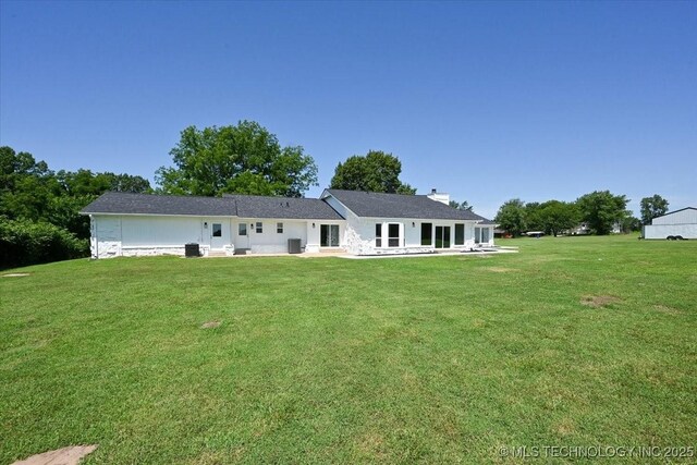 13973 S 237th E Ave, Coweta, OK 74429 - back of property with a yard, a chimney, and a patio area