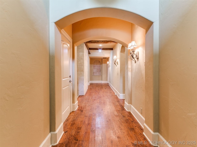 9314 S 76th E Ave, Tulsa, OK 74133 - corridor with arched walkways and wood finished floors