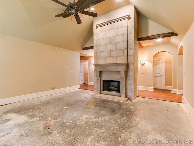 9314 S 76th E Ave, Tulsa, OK 74133 - unfurnished living room with ceiling fan, high vaulted ceiling, a fireplace, and arched walkways