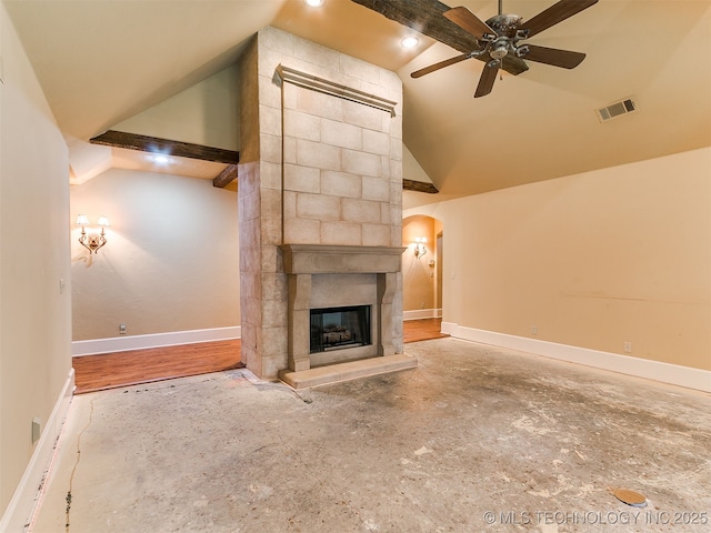 9314 S 76th E Ave, Tulsa, OK 74133 - unfurnished living room with vaulted ceiling, a fireplace, a ceiling fan, and arched walkways