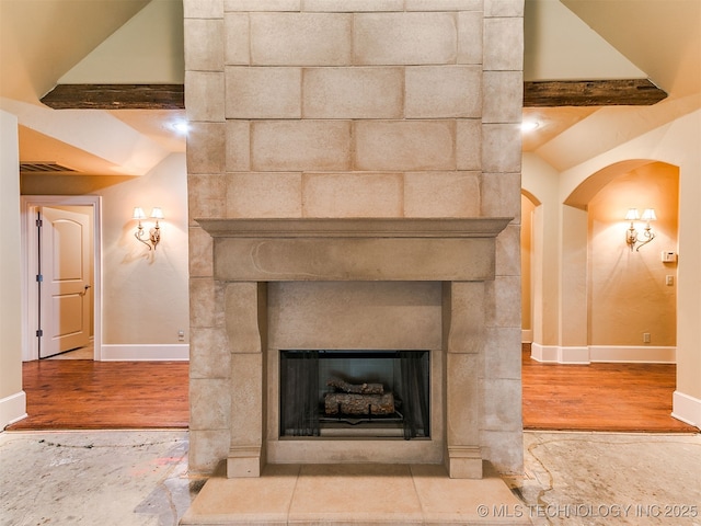 9314 S 76th E Ave, Tulsa, OK 74133 - detailed view of wood finished floors, arched walkways, and a fireplace