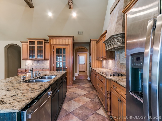 9314 S 76th E Ave, Tulsa, OK 74133 - kitchen with appliances with stainless steel finishes, arched walkways, premium range hood, high vaulted ceiling, and backsplash