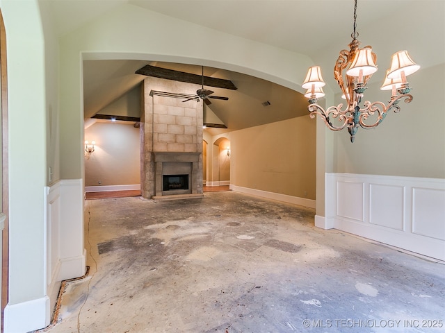 9314 S 76th E Ave, Tulsa, OK 74133 - unfurnished living room with arched walkways, a ceiling fan, vaulted ceiling, unfinished concrete flooring, and a large fireplace