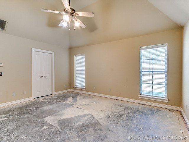9314 S 76th E Ave, Tulsa, OK 74133 - unfurnished bedroom featuring vaulted ceiling, a closet, and a ceiling fan