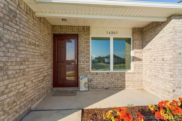 14203 N 76th Ave, Collinsville, OK 74021 - doorway to property with brick siding