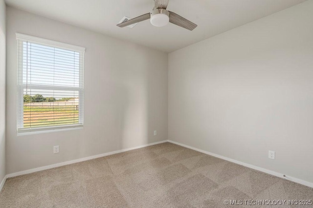14203 N 76th Ave, Collinsville, OK 74021 - spare room featuring carpet flooring and a ceiling fan