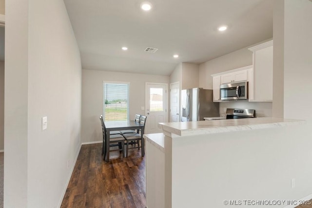 14203 N 76th Ave, Collinsville, OK 74021 - kitchen featuring stainless steel appliances, dark wood-type flooring, white cabinets, light countertops, and recessed lighting