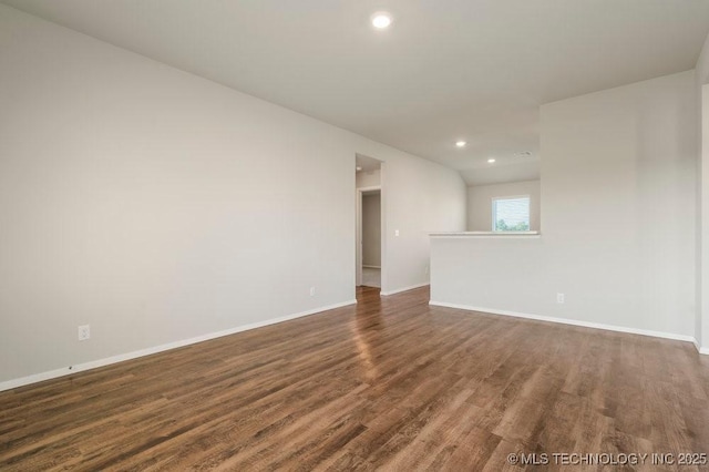 14203 N 76th Ave, Collinsville, OK 74021 - unfurnished room featuring dark wood finished floors and recessed lighting