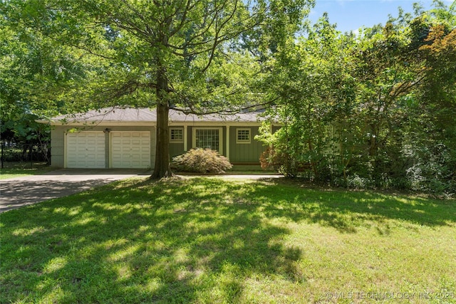 4135 S Zunis Ave, Tulsa, OK 74105 - view of front facade featuring a garage, concrete driveway, a front lawn, and board and batten siding