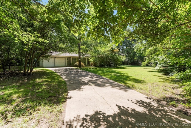 4135 S Zunis Ave, Tulsa, OK 74105 - view of front of house featuring an attached garage, driveway, and a front lawn
