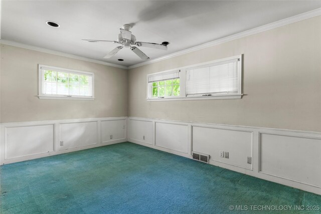 4135 S Zunis Ave, Tulsa, OK 74105 - unfurnished room with plenty of natural light, light carpet, a decorative wall, ornamental molding, and wainscoting