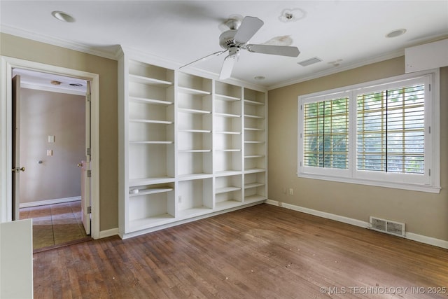 4135 S Zunis Ave, Tulsa, OK 74105 - spare room featuring ornamental molding, wood finished floors, ceiling fan, and built in shelves
