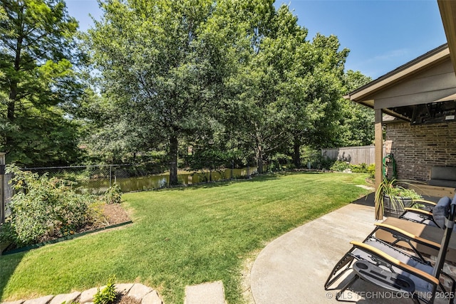 1116 W Fargo Dr, Broken Arrow, OK 74012 - fenced backyard with a patio and view of scattered trees