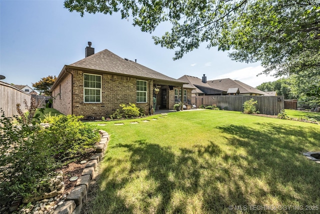 1116 W Fargo Dr, Broken Arrow, OK 74012 - back of property with brick siding, a fenced backyard, a chimney, and roof with shingles