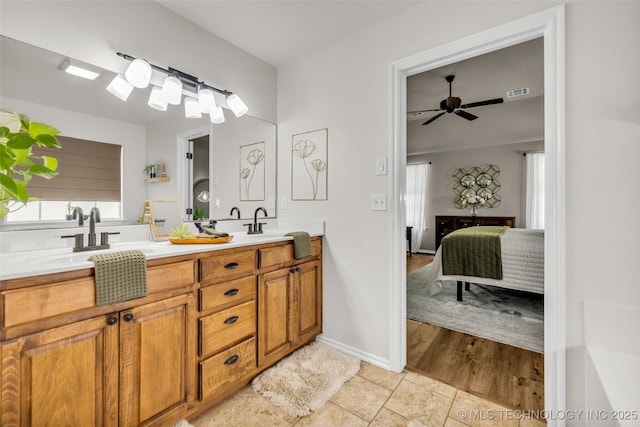 1116 W Fargo Dr, Broken Arrow, OK 74012 - ensuite bathroom with double vanity, tile patterned flooring, and a ceiling fan