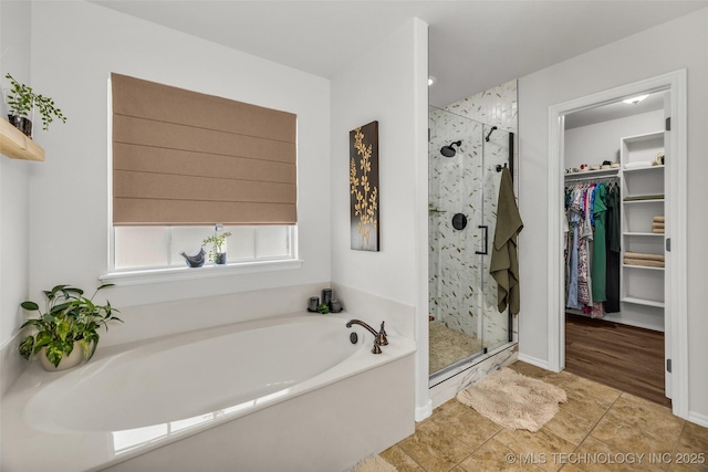 1116 W Fargo Dr, Broken Arrow, OK 74012 - bathroom with a bath, a shower stall, a walk in closet, and tile patterned floors