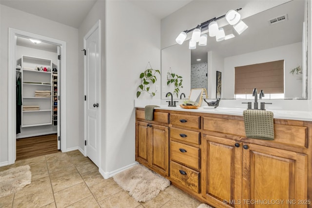 1116 W Fargo Dr, Broken Arrow, OK 74012 - full bathroom with double vanity, tile patterned flooring, and a walk in closet